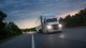 Fifth Generation Freightliner Cascadia on the road at night